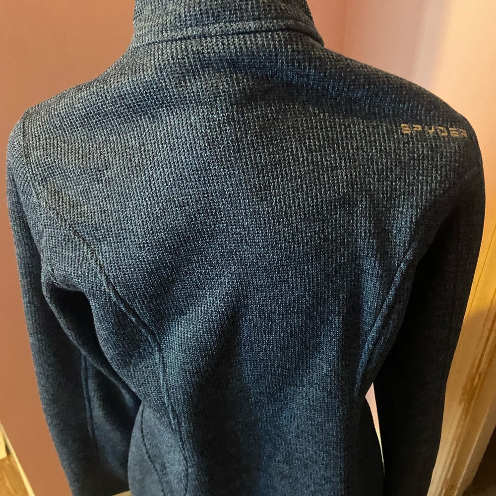 Spyder Blue Ski Jacket with High Collar and Textured Fabric